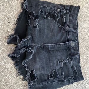 American eagle black distressed jean shorts.
